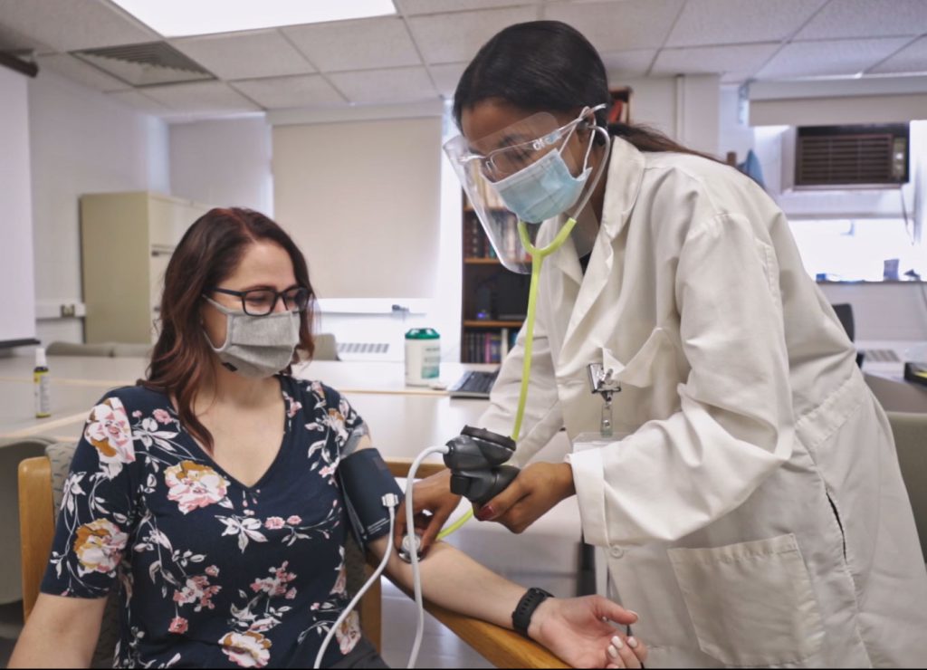 Doctor taking blood pressure